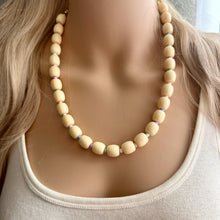 Load image into Gallery viewer, Creamy Pastel Statement Necklace, single strand Geometric Beaded Jewelry, off white bib necklace, shell necklace, champagne