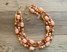 Load image into Gallery viewer, Devine Golden Necklace, Coral RoseGold Necklace, multi strand jewelry, big beaded chunky statement necklace, coral bib necklace