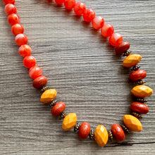 Load image into Gallery viewer, Fall Festival Chunky Statement Necklace, gold bib necklace, honey red brown gold necklace, geometric chain beaded mustard orange