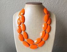 Load image into Gallery viewer, Orange Oval Chunky Statement Necklace, Big beaded bib jewelry, Double Strand Statement Necklace, geometric bright orange bridesmaid wedding