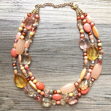 Load image into Gallery viewer, Peach Chunky Statement Necklace & Stretch Bracelet set, Triple Strand Beaded Jewelry, coral pink jewelry, peach bridesmaid marigold gold