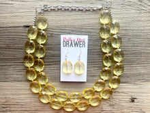 Load image into Gallery viewer, Pale Yellow Statement Necklace, Oval Beaded Everyday yellow jewelry, silver accents chunky bib necklace, clear resin lucite earrings yellow
