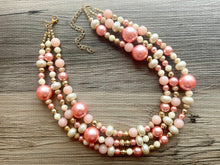 Load image into Gallery viewer, Coral White & Gold Necklace, triple strand gold jewelry, big beaded chunky statement necklace, pink white cream necklace, gold jewelry