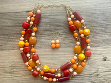 Load image into Gallery viewer, Crisp Fall Breeze Chunky Statement Necklace, Big beaded jewelry, multi strand Statement Earrings, chunky bib orange yellow mustard brown
