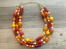 Load image into Gallery viewer, Crisp Fall Breeze Chunky Statement Necklace, Big beaded jewelry, multi strand Statement Earrings, chunky bib orange yellow mustard brown