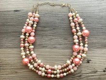 Load image into Gallery viewer, Coral White & Gold Necklace, triple strand gold jewelry, big beaded chunky statement necklace, pink white cream necklace, gold jewelry