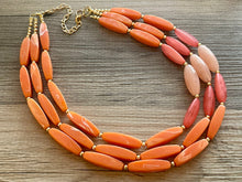 Load image into Gallery viewer, Clementine Sky Chunky 3 Strand Statement Necklace, Orange coral pink jewelry, orange color block statement, peach summer fall necklace