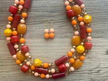 Load image into Gallery viewer, Crisp Fall Breeze Chunky Statement Necklace, Big beaded jewelry, multi strand Statement Earrings, chunky bib orange yellow mustard brown