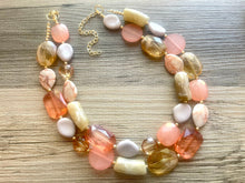 Load image into Gallery viewer, Masai Mara chunky necklace, Wanderlust Collection beaded jewelry, resin beaded Ombré necklace, tan champagne coral peach