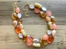 Load image into Gallery viewer, Masai Mara chunky necklace, Wanderlust Collection beaded jewelry, resin beaded Ombré necklace, tan champagne coral peach