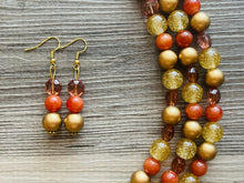 Load image into Gallery viewer, Cardigan Fall Statement Necklace, chunky bib beaded jewelry, Burnt orange bead bib necklace, beaded jewelry dark brown gold glitter earrings