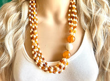 Load image into Gallery viewer, Orange & Cream Statement Necklace, 6 strand chunky long necklace, teal jewelry, warm orange white acrylic vintage beaded necklace