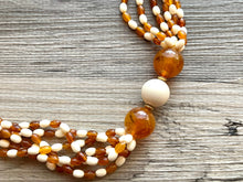 Load image into Gallery viewer, Orange & Cream Statement Necklace, 6 strand chunky long necklace, teal jewelry, warm orange white acrylic vintage beaded necklace