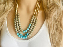Load image into Gallery viewer, Blue turquoise statement necklace, chunky bib beaded jewelry light blue necklace, multi strand wood & gold, Traveler Collection