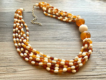 Load image into Gallery viewer, Orange & Cream Statement Necklace, 6 strand chunky long necklace, teal jewelry, warm orange white acrylic vintage beaded necklace