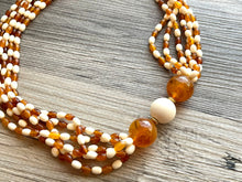 Load image into Gallery viewer, Orange & Cream Statement Necklace, 6 strand chunky long necklace, teal jewelry, warm orange white acrylic vintage beaded necklace