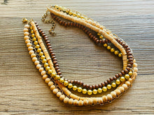 Load image into Gallery viewer, Gold & Brown statement necklace, chunky bib beaded jewelry 5 strand neutral necklace, wood multi strand wood, Traveler Collection