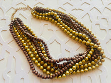 Load image into Gallery viewer, Gold & Brown statement necklace, chunky bib beaded jewelry 6 strand neutral necklace, wood multi strand wood, Traveler Collection metallic