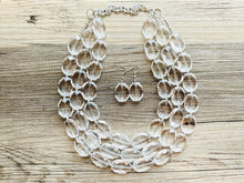 Load image into Gallery viewer, Faceted Resin Beaded Statement Necklace, 3 strand Oval Bead Everyday neutral jewelry, silver accents chunky bib necklace, bridesmaid wedding