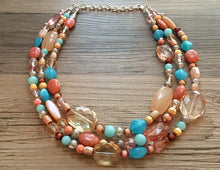 Load image into Gallery viewer, Peach Teal Coral Chunky Statement Necklace, Triple Strand Beaded Jewelry, blue peach coral jewelry, bridsmaid wedding, bib beaded jewelry