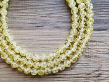 Load image into Gallery viewer, Speckled Pale Yellow Statement jewelry set, Chunky Beaded Necklace, yellow Jewelry, bright colorful Necklace yellow beaded earrings gold