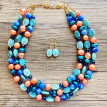 Load image into Gallery viewer, Fairy Dust Statement Necklace, multi Strand Beaded Jewelry, Blue Orange jewelry, gold and blue necklace, turquoise coral aqua big beaded