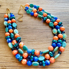 Load image into Gallery viewer, Fairy Dust Statement Necklace, multi Strand Beaded Jewelry, Blue Orange jewelry, gold and blue necklace, turquoise coral aqua big beaded