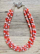 Load image into Gallery viewer, Chunky Multi Strand Grapefruit Statement Necklace, pink coral orange beaded jewelry, jelly necklace, coral jewelry, blush pink dress dressy