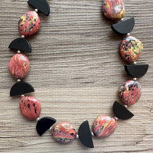 Load image into Gallery viewer, Swirl Coral &amp; Black Chunky Statement Necklace, Pink and black beaded jewelry, single Strand Bib Necklace, Beaded necklace, wood necklace