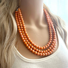 Load image into Gallery viewer, Chunky Multi 3 Strand Statement Necklace, orange peel beaded jewelry, shiny orange jewelry, chunky bib metallic ball beads