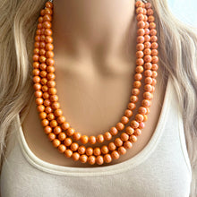 Load image into Gallery viewer, Chunky Multi 3 Strand Statement Necklace, orange peel beaded jewelry, shiny orange jewelry, chunky bib metallic ball beads