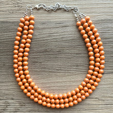 Load image into Gallery viewer, Chunky Multi 3 Strand Statement Necklace, orange peel beaded jewelry, shiny orange jewelry, chunky bib metallic ball beads