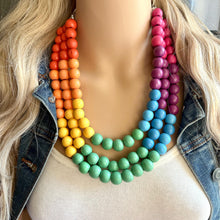 Load image into Gallery viewer, Rainbow Wood Bubble Statement, wooden jewelry, silver chain thick bib chunky necklace, 3 strand red orange yellow green blue purple pink