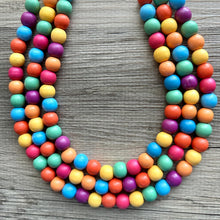 Load image into Gallery viewer, Rainbow Wood Bubble Statement, wooden jewelry, silver chain thick bib chunky necklace, 3 strand red orange yellow green blue purple pink