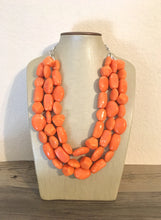 Load image into Gallery viewer, Orange 3 Strand XL statement necklace, big beaded necklace, chunky jewelry, orange necklace, resin necklace, multi-strand bib jewelry