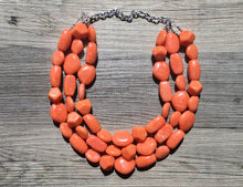 Load image into Gallery viewer, Orange 3 Strand XL statement necklace, big beaded necklace, chunky jewelry, orange necklace, resin necklace, multi-strand bib jewelry