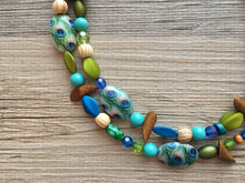 Load image into Gallery viewer, Mermaid Peacock Chunky Statement Necklace, Triple Strand Beaded Jewelry wood Blue Green jewelry, bridesmaid wedding bib resin