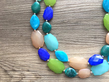Load image into Gallery viewer, Beachy Blue Statement Necklace, chunky bib beaded jewelry, neutral jewelry, champagne blue green necklace, beaded acrylic jewelry