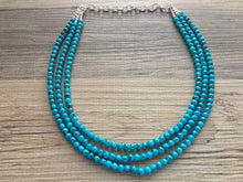 Load image into Gallery viewer, Teal Blue + Black 3 strand Beaded Statement Necklace, Chunky Bib white and Teal Multi-Strand Jewelry Light blue swirl beads ocean side