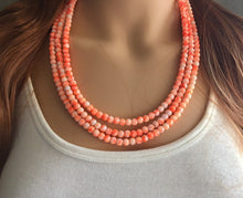 Load image into Gallery viewer, Neon Orange TIE DYE 3 strand Beaded Statement Necklace, Chunky Bib white and Orange Multi-Strand Jewelry Light swirl, neon jewelry
