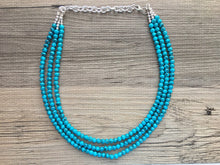 Load image into Gallery viewer, Teal Blue + Black 3 strand Beaded Statement Necklace, Chunky Bib white and Teal Multi-Strand Jewelry Light blue swirl beads ocean side