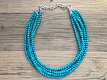 Load image into Gallery viewer, Teal Blue + Black 5 strand Beaded Statement Necklace, Chunky Bib white and Teal Multi-Strand Jewelry Light blue swirl beads ocean side