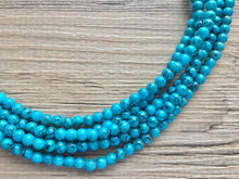 Load image into Gallery viewer, Teal Blue + Black 5 strand Beaded Statement Necklace, Chunky Bib white and Teal Multi-Strand Jewelry Light blue swirl beads ocean side