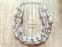 Load image into Gallery viewer, Silver and Clear statement necklace, lucite necklace, resin necklace, clear three strand chunky jewelry, silver Beaded Holiday Necklace
