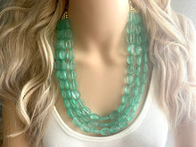 Load image into Gallery viewer, Mint Green Chunky Statement Necklace &amp; Stretch Bracelet set, Triple Strand Beaded Jewelry, Green jewelry, bridesmaid gold jelly bean