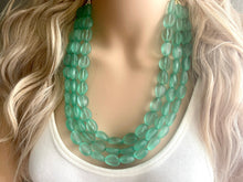 Load image into Gallery viewer, Mint Green Chunky Statement Necklace &amp; Stretch Bracelet set, Triple Strand Beaded Jewelry, Green jewelry, bridesmaid gold jelly bean