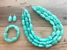 Load image into Gallery viewer, Mint Green Chunky Statement Necklace &amp; Stretch Bracelet set, Triple Strand Beaded Jewelry, Green jewelry, bridesmaid gold jelly bean