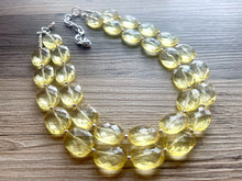 Load image into Gallery viewer, Pale Yellow Statement Necklace, Oval Beaded Everyday yellow jewelry, silver accents chunky bib necklace, clear resin lucite earrings yellow