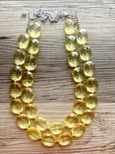 Load image into Gallery viewer, Pale Yellow Statement Necklace, Oval Beaded Everyday yellow jewelry, silver accents chunky bib necklace, clear resin lucite earrings yellow