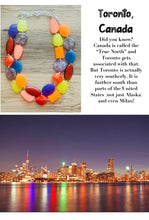 Load image into Gallery viewer, Toronto Nights chunky necklace, Wanderlust Collection beaded jewelry, resin beaded Gray necklace, red yellow purple Canada necklace